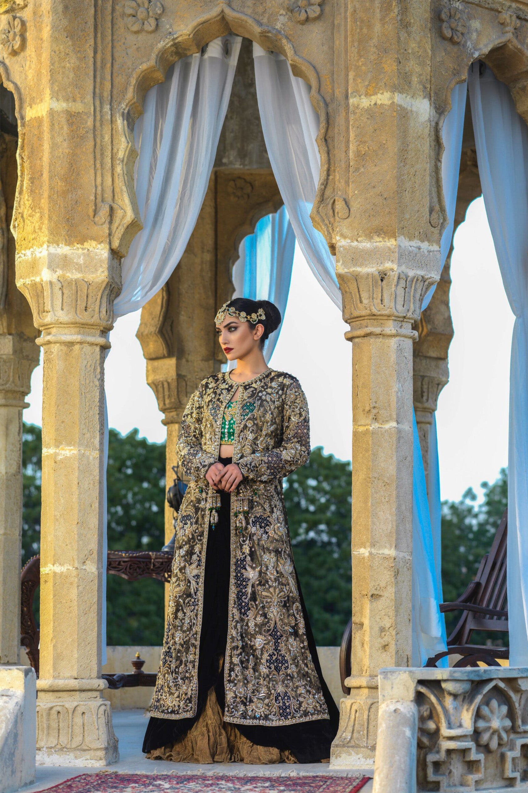 Gold Velvet Coat with Emerald Bustier & Black Velvet Cowl Lehenga
