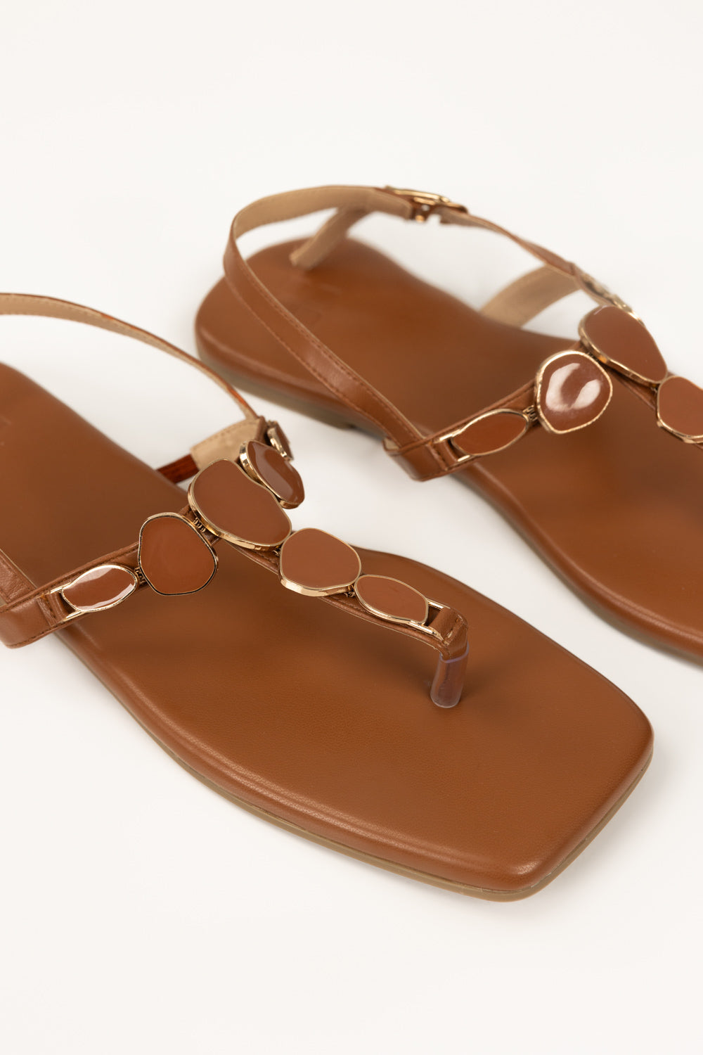 https://cdn.shopify.com/s/files/1/0706/3253/8159/files/467868-tan-sandal-closeup1-ideas.jpg?v=1779690609