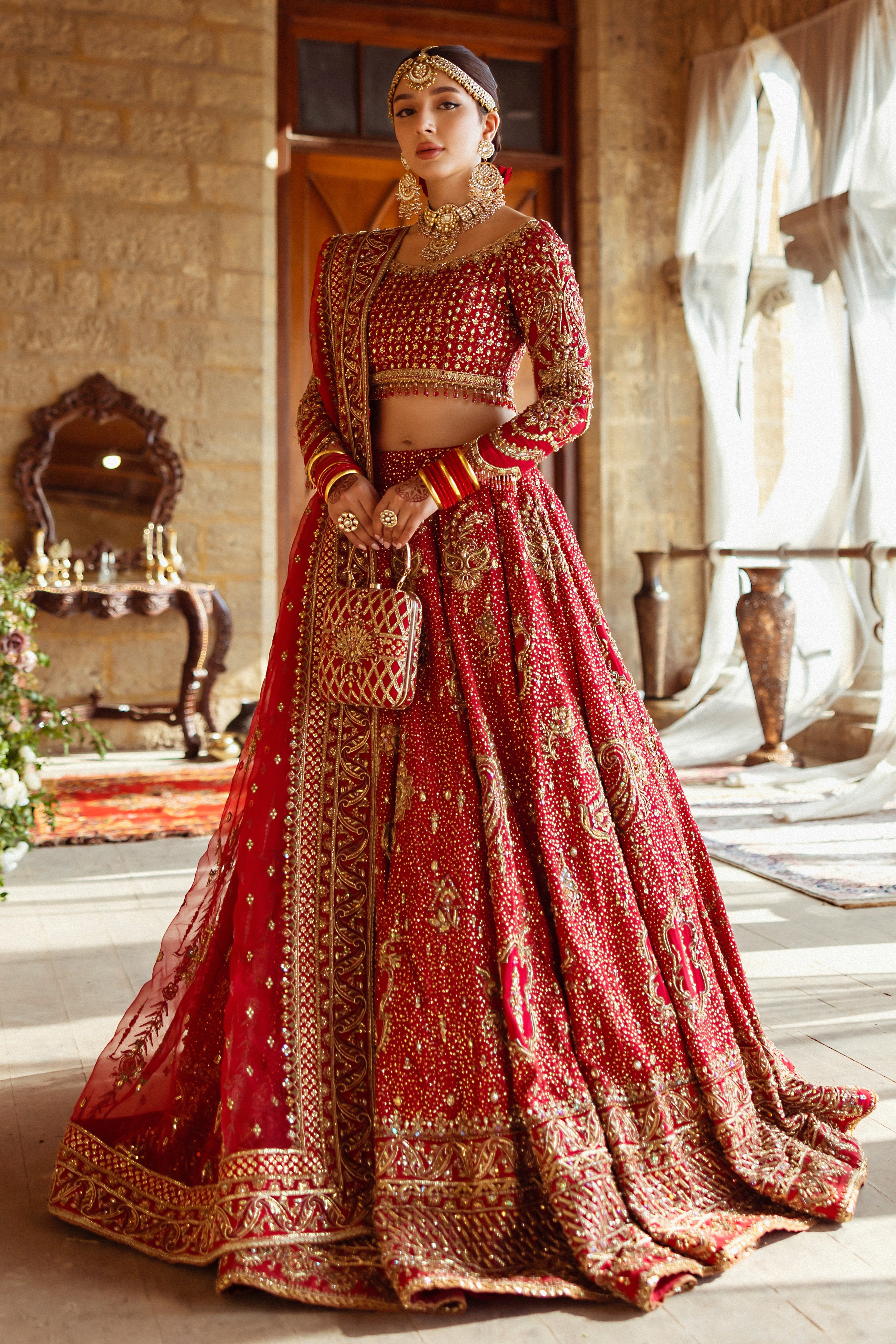 Shahana crimson red bridal lehenga choli by NAQSHI, full front view with heavily embellished raw silk choli, flared lehe