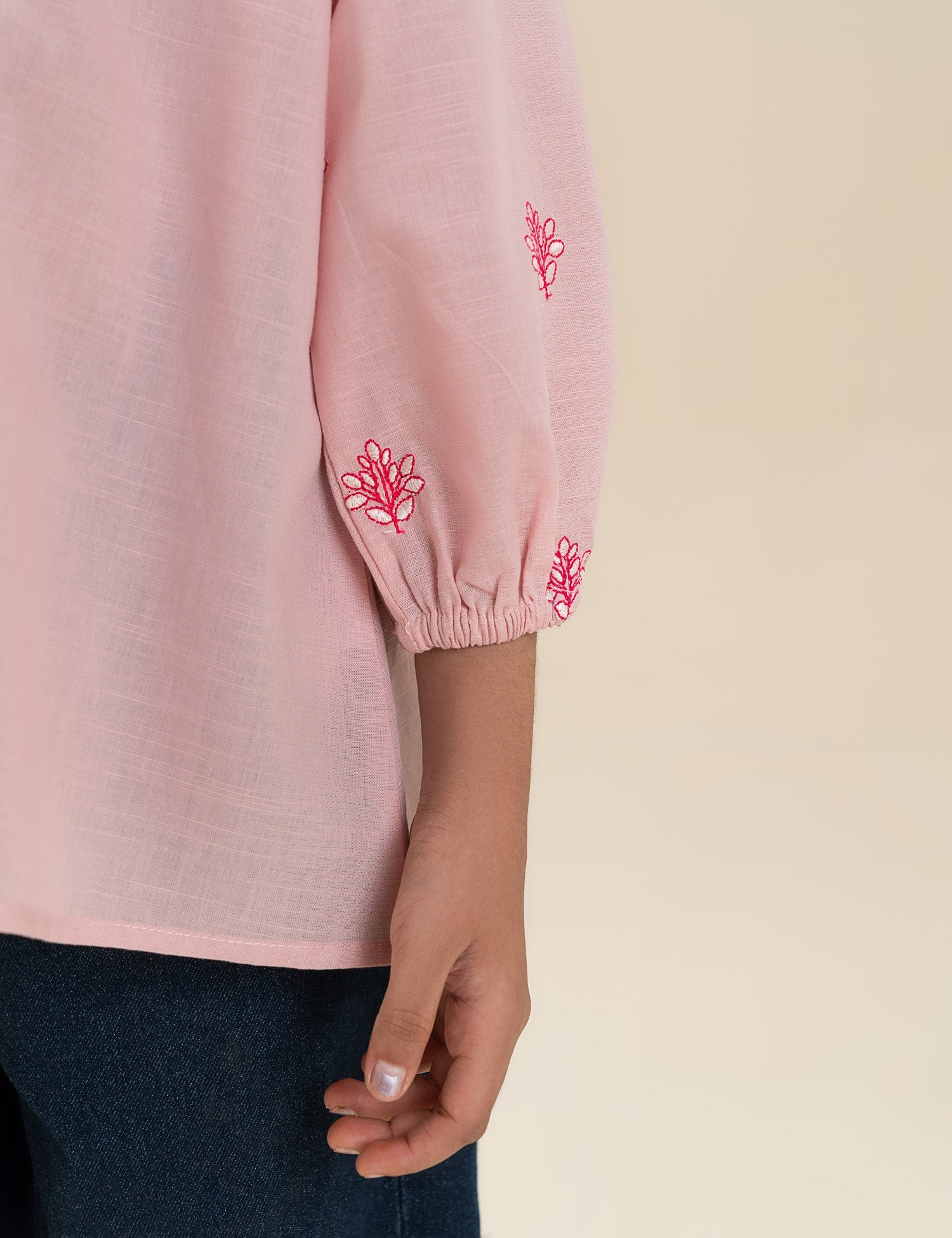 EMBROIDERED TIE-NECK TOP