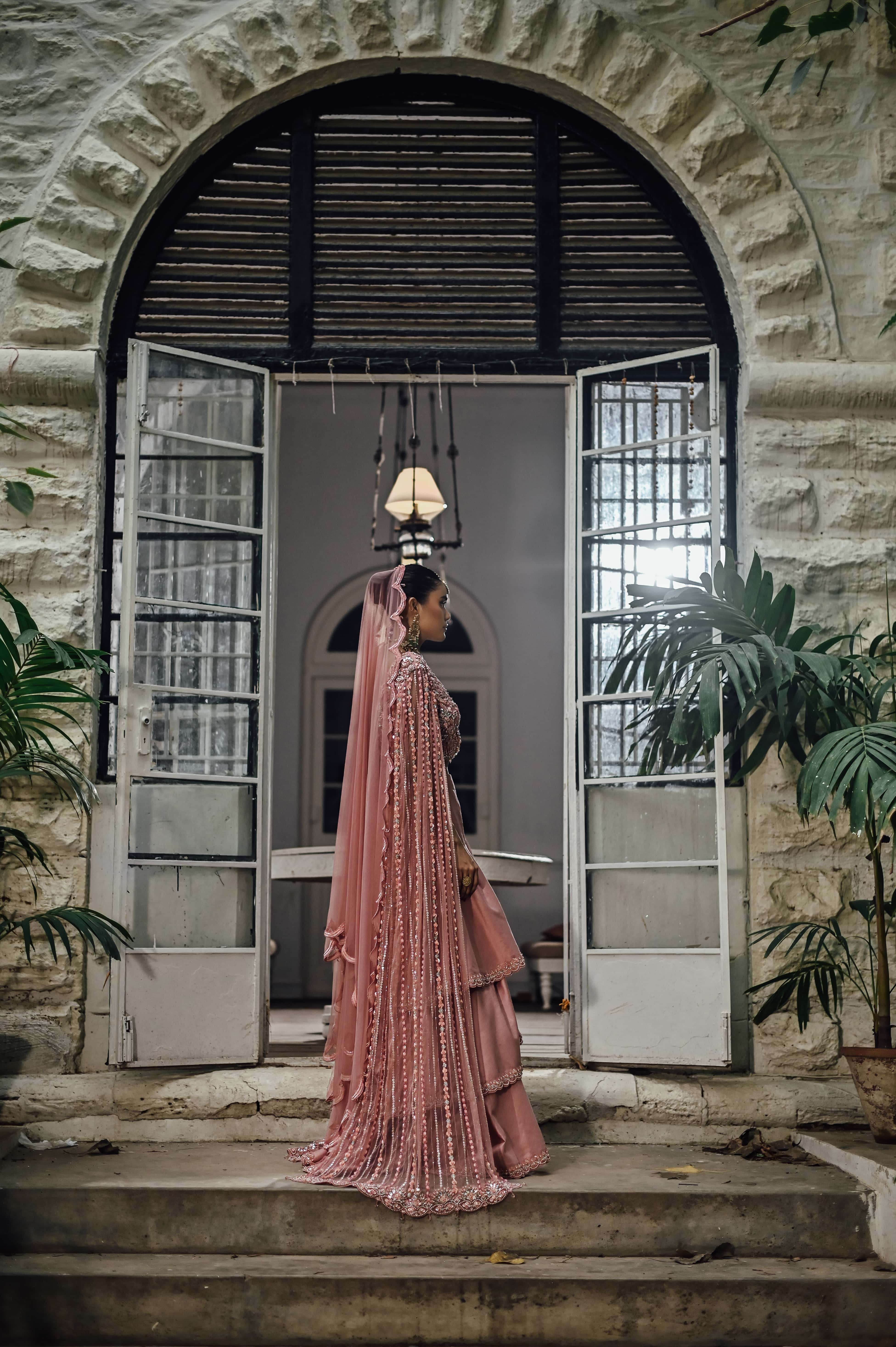 Pink Embellished Choli with Ruffled Skirt and Net Dupatta