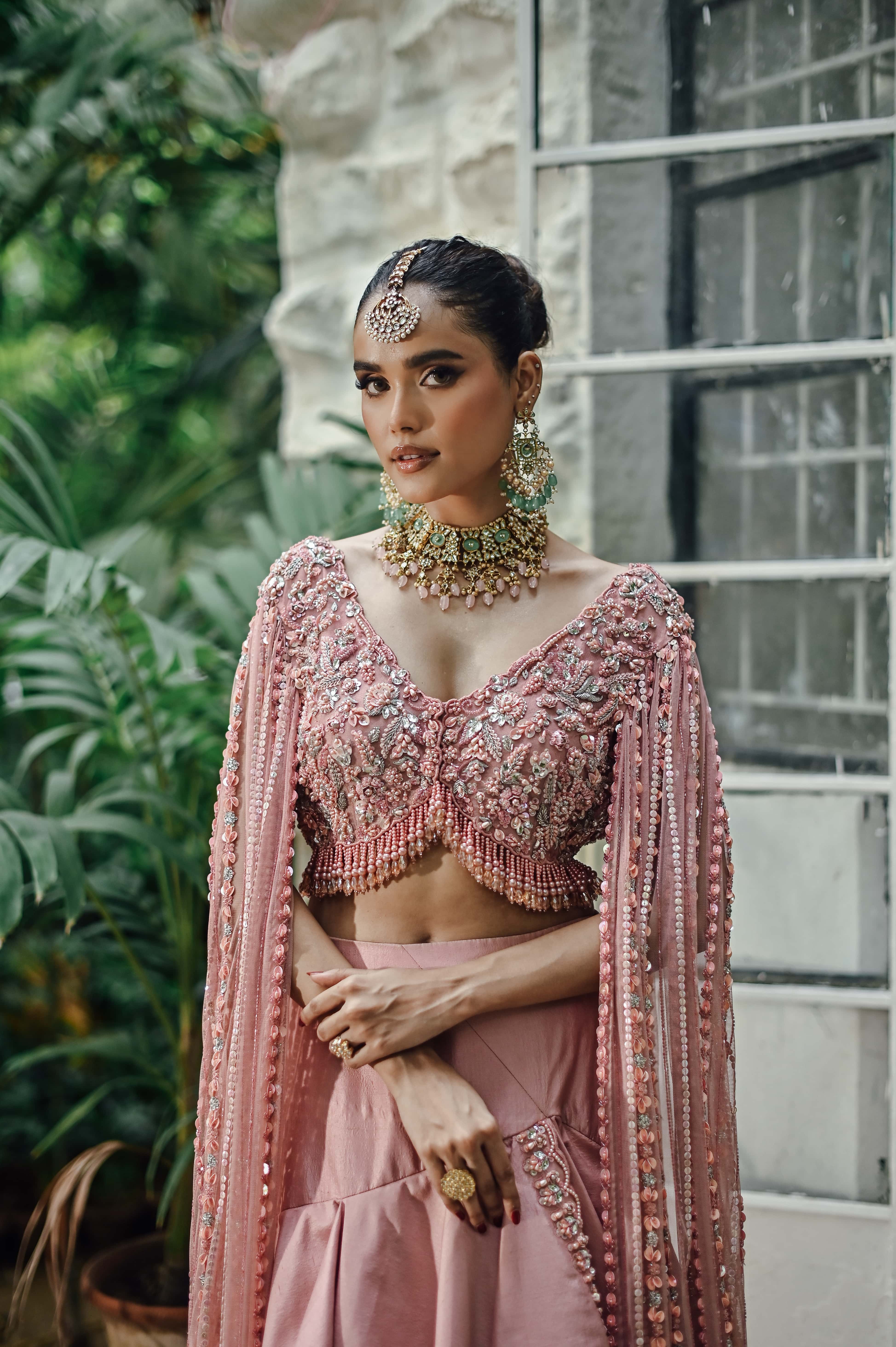 Pink Embellished Choli with Ruffled Skirt and Net Dupatta