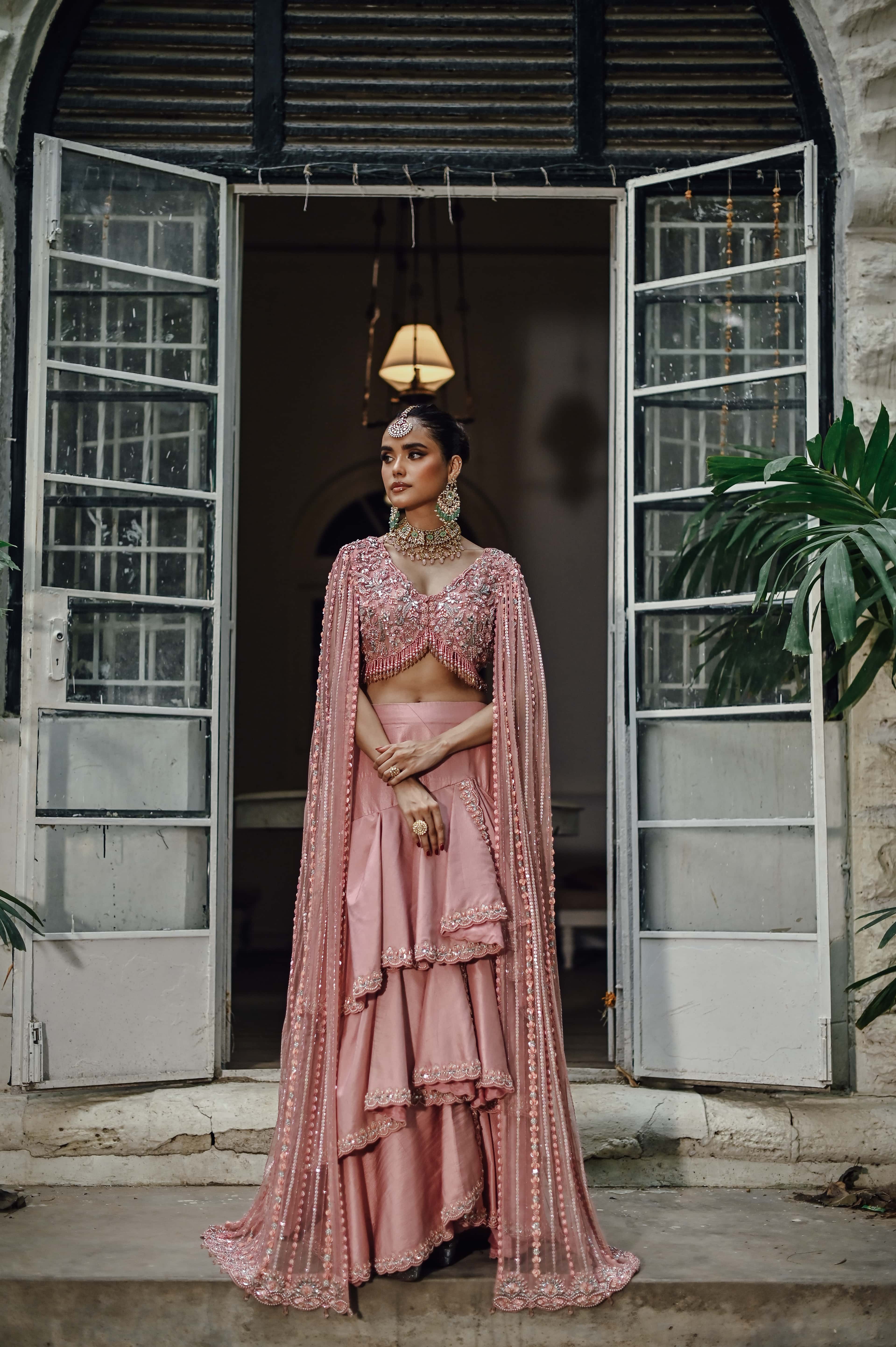 Pink Embellished Choli with Ruffled Skirt and Net Dupatta
