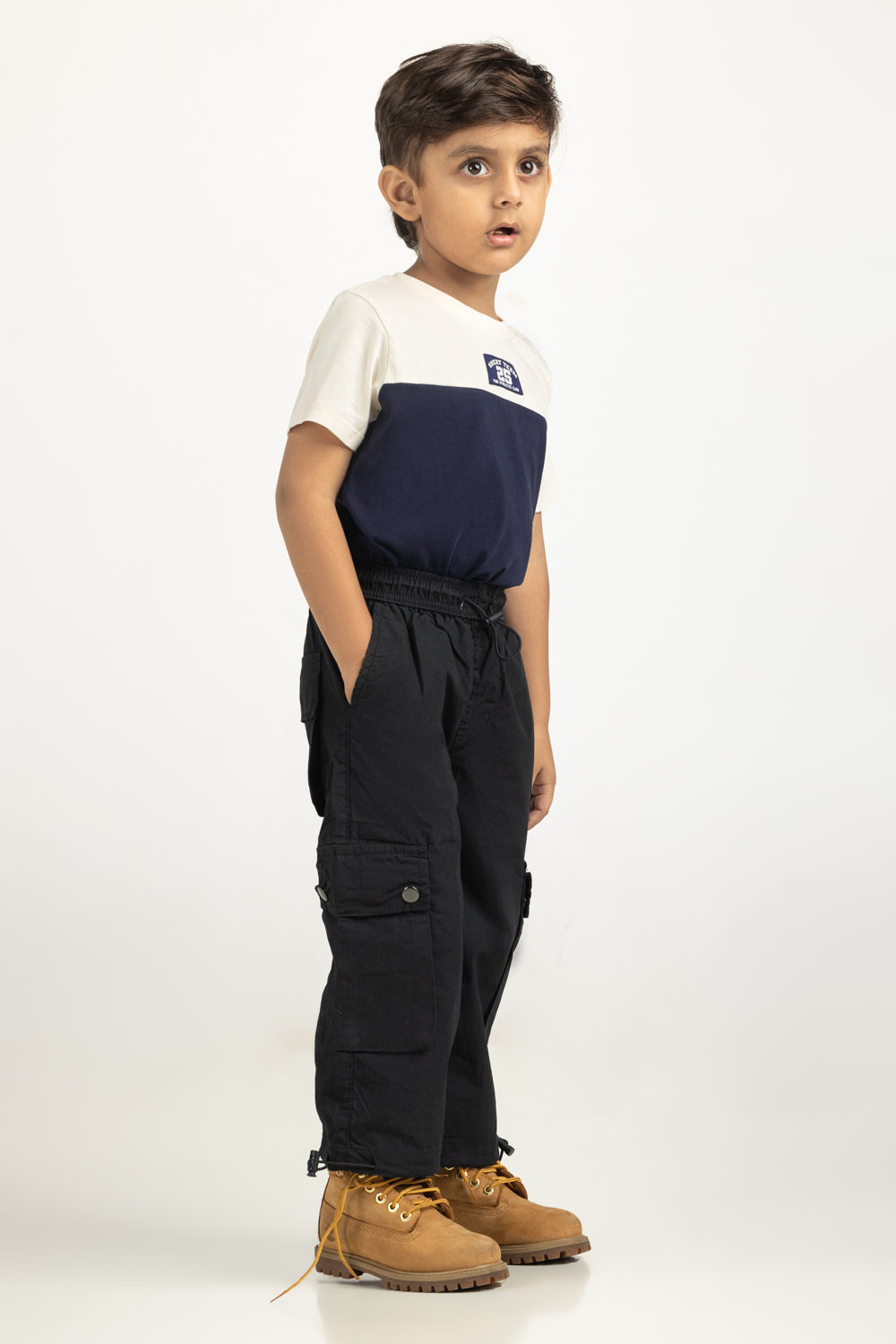 https://cdn.shopify.com/s/files/1/0706/3253/8159/files/Salt-Kids-Trousers-Color-Black-100_-Cotton-Cargo-Fit-TB-TRC-SS25-002-Right.jpg?v=1761636356