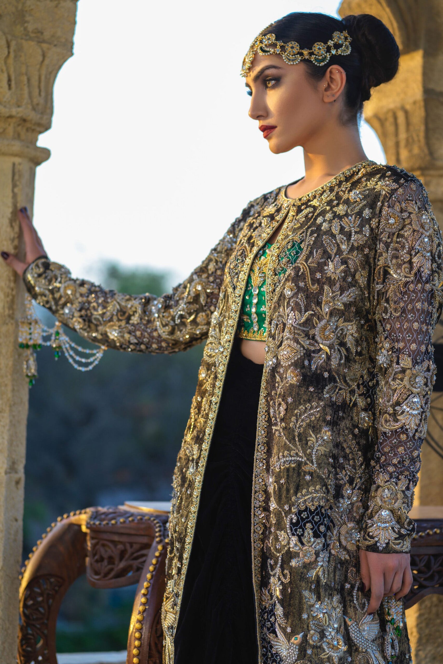 Gold Velvet Coat with Emerald Bustier & Black Velvet Cowl Lehenga