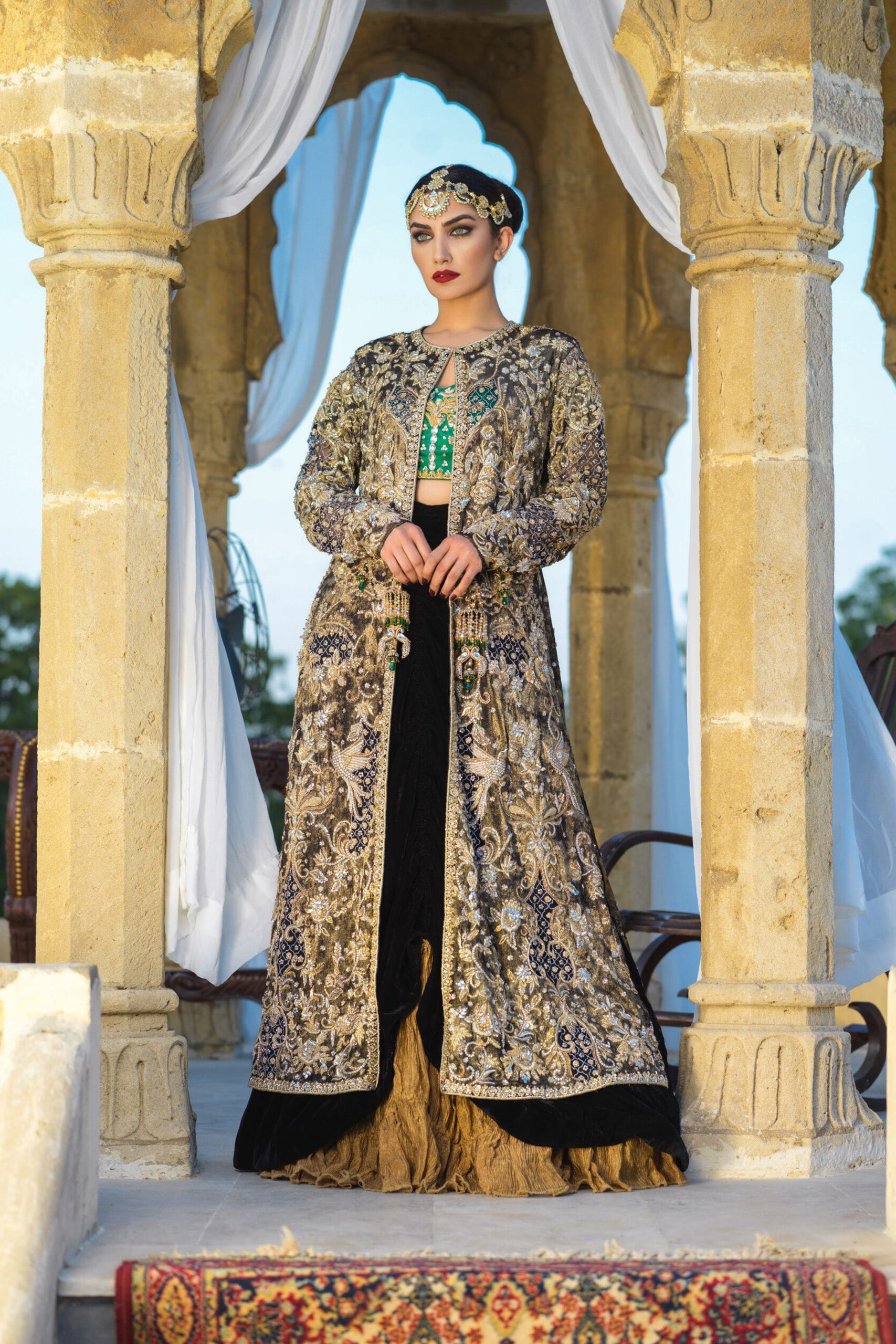 Gold Velvet Coat with Emerald Bustier & Black Velvet Cowl Lehenga