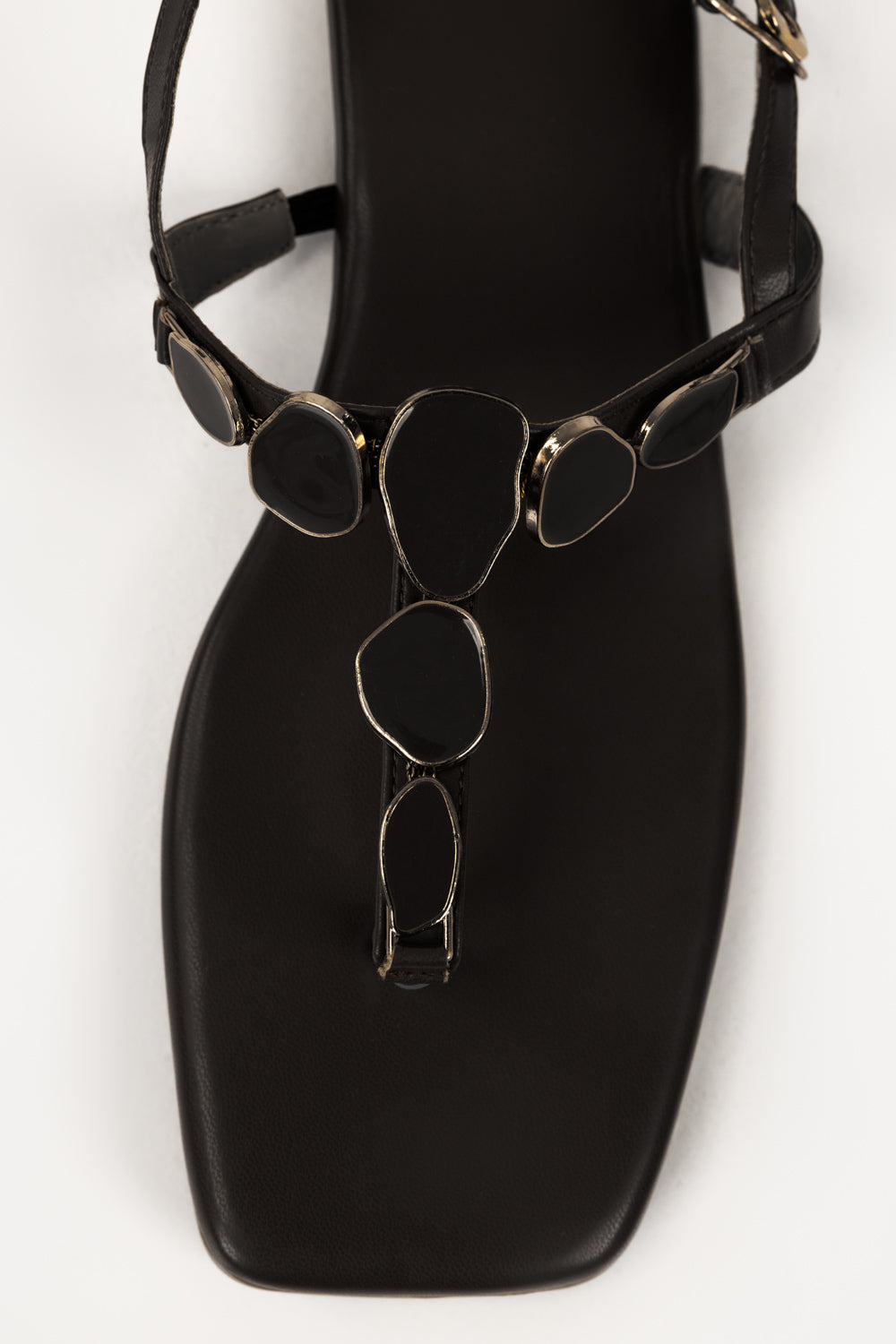 https://cdn.shopify.com/s/files/1/0706/3253/8159/files/467874-black-sandal-closeup2-ideas.jpg?v=1779690658