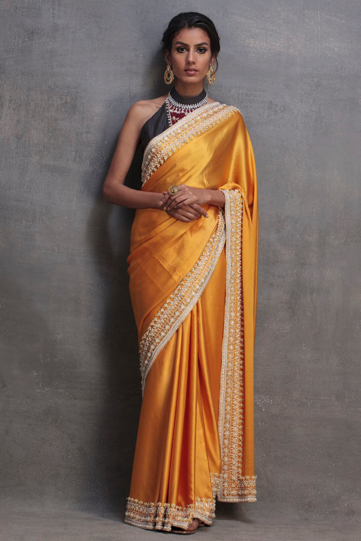 https://cdn.shopify.com/s/files/1/0790/3779/2529/files/MarigoldSaree.jpg?v=1713783731