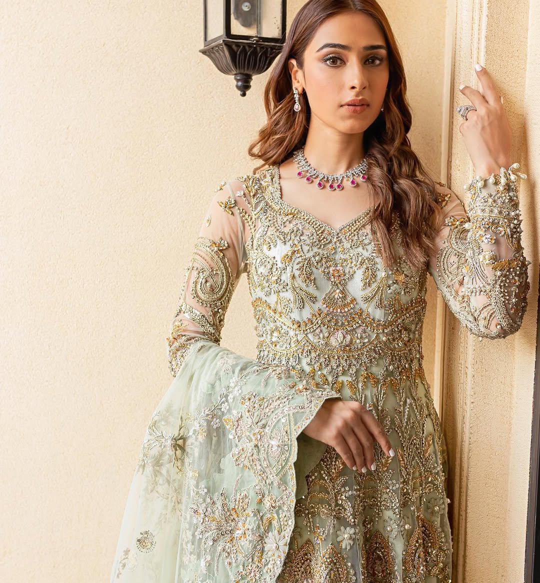 https://cdn.shopify.com/s/files/1/0523/4327/5696/files/Pakistani-bridal-outfit-Cleo-mint-green-frock-and-raw-silk-lehenga-mysie-10.jpg?v=1757927084
