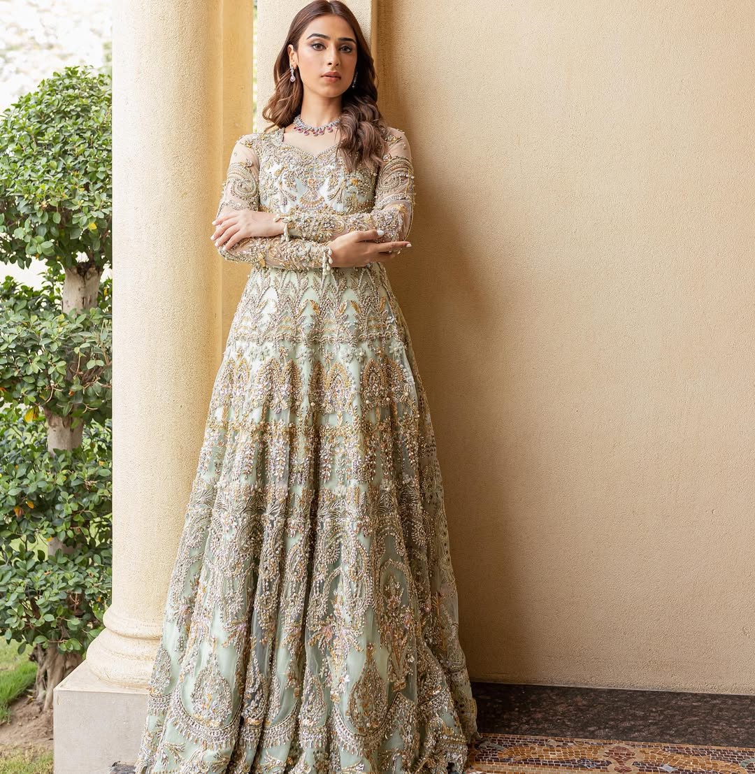 https://cdn.shopify.com/s/files/1/0523/4327/5696/files/Pakistani-bridal-outfit-Cleo-mint-green-frock-and-raw-silk-lehenga-mysie-7.jpg?v=1757927085
