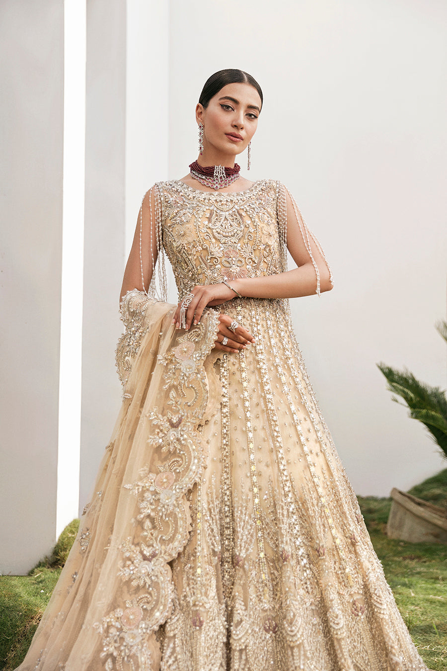 https://cdn.shopify.com/s/files/1/0523/4327/5696/products/Pakistani-bridal-outfit-Maia-champagne-gold-net-gown-mysie-2.jpg?v=1757929580
