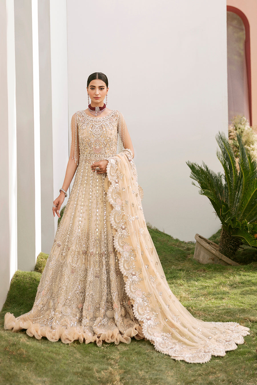 https://cdn.shopify.com/s/files/1/0523/4327/5696/products/Pakistani-bridal-outfit-Maia-champagne-gold-net-gown-mysie-3.jpg?v=1757929580