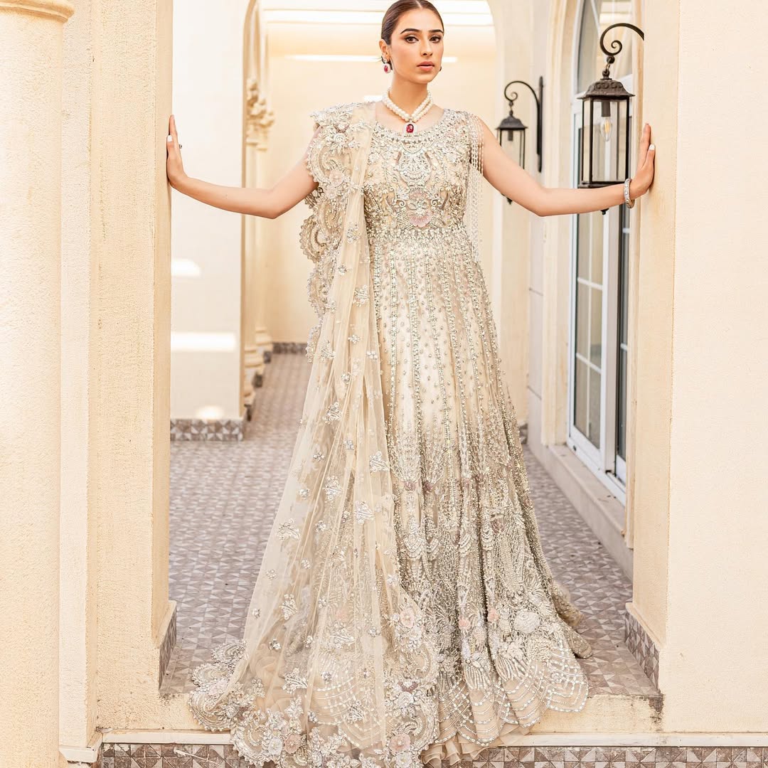https://cdn.shopify.com/s/files/1/0523/4327/5696/files/Pakistani-bridal-outfit-Maia-champagne-gold-net-gown-mysie-4.jpg?v=1757929580