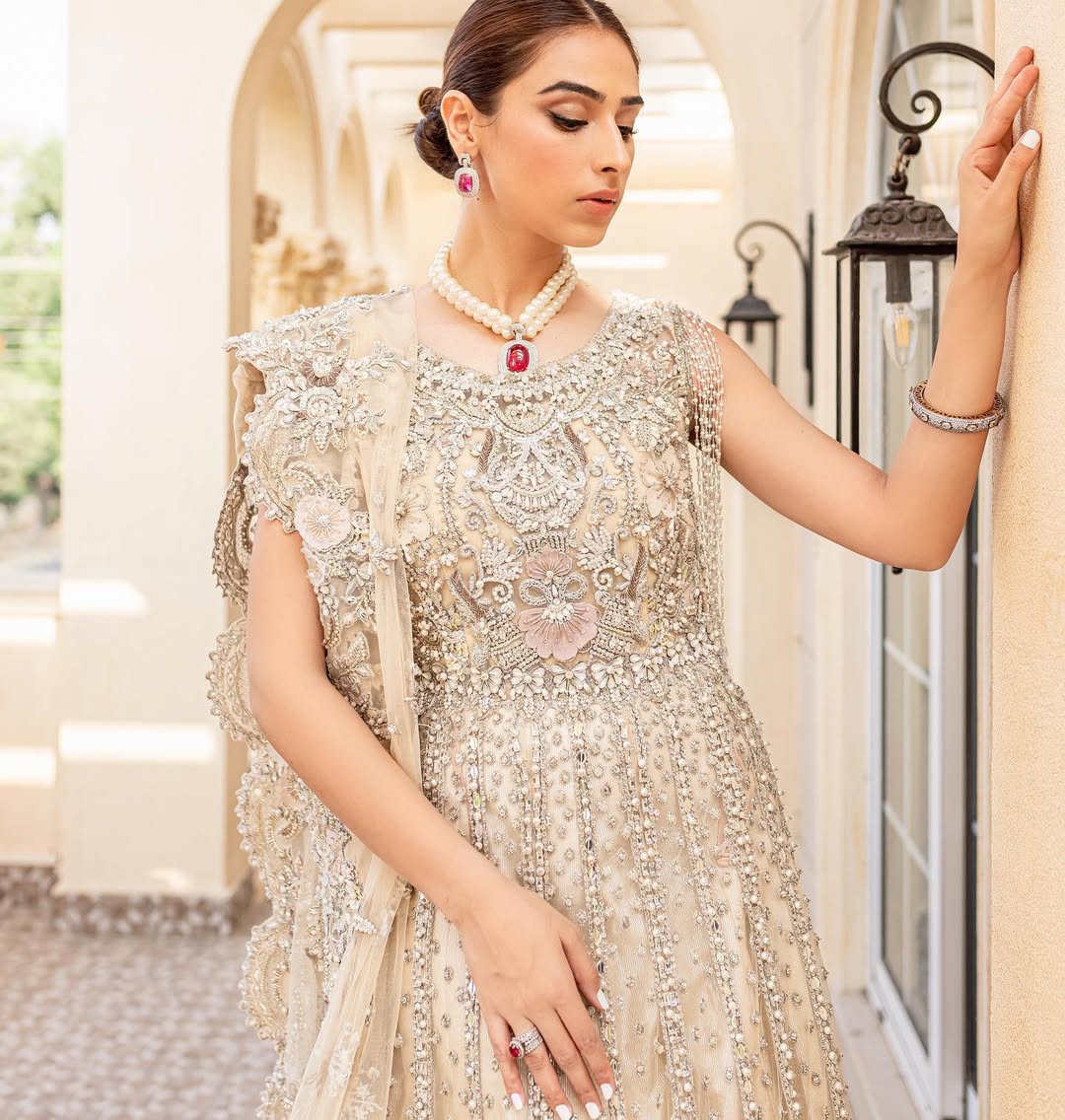 https://cdn.shopify.com/s/files/1/0523/4327/5696/files/Pakistani-bridal-outfit-Maia-champagne-gold-net-gown-mysie-6.jpg?v=1757929580
