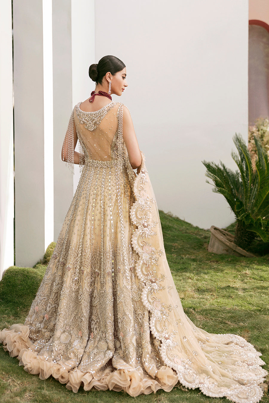 https://cdn.shopify.com/s/files/1/0523/4327/5696/products/Pakistani-bridal-outfit-Maia-champagne-gold-net-gown-mysie-7.jpg?v=1757929580