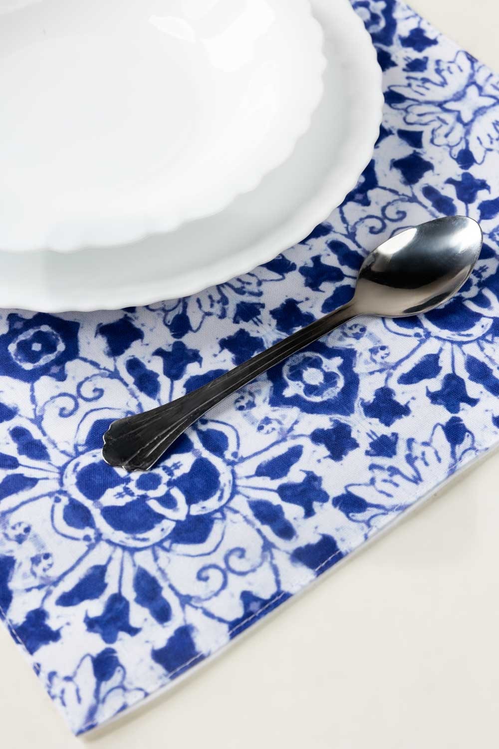 https://cdn.shopify.com/s/files/1/0706/3253/8159/files/blue-tiles-digital-place-mats-set-gulahmed-closeup-4_jpg.jpg?v=1758373775