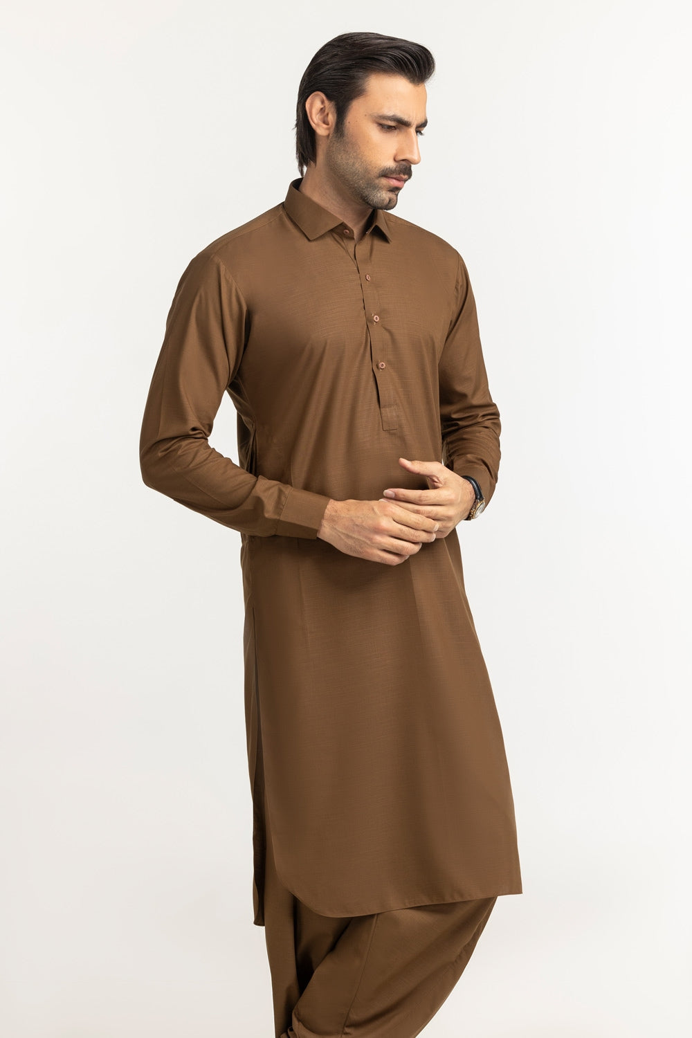 https://cdn.shopify.com/s/files/1/0706/3253/8159/files/catalyst-co-unstitched-fabric-washnwear-dark-kathai-brown-midshot-side01.jpg?v=1758383502
