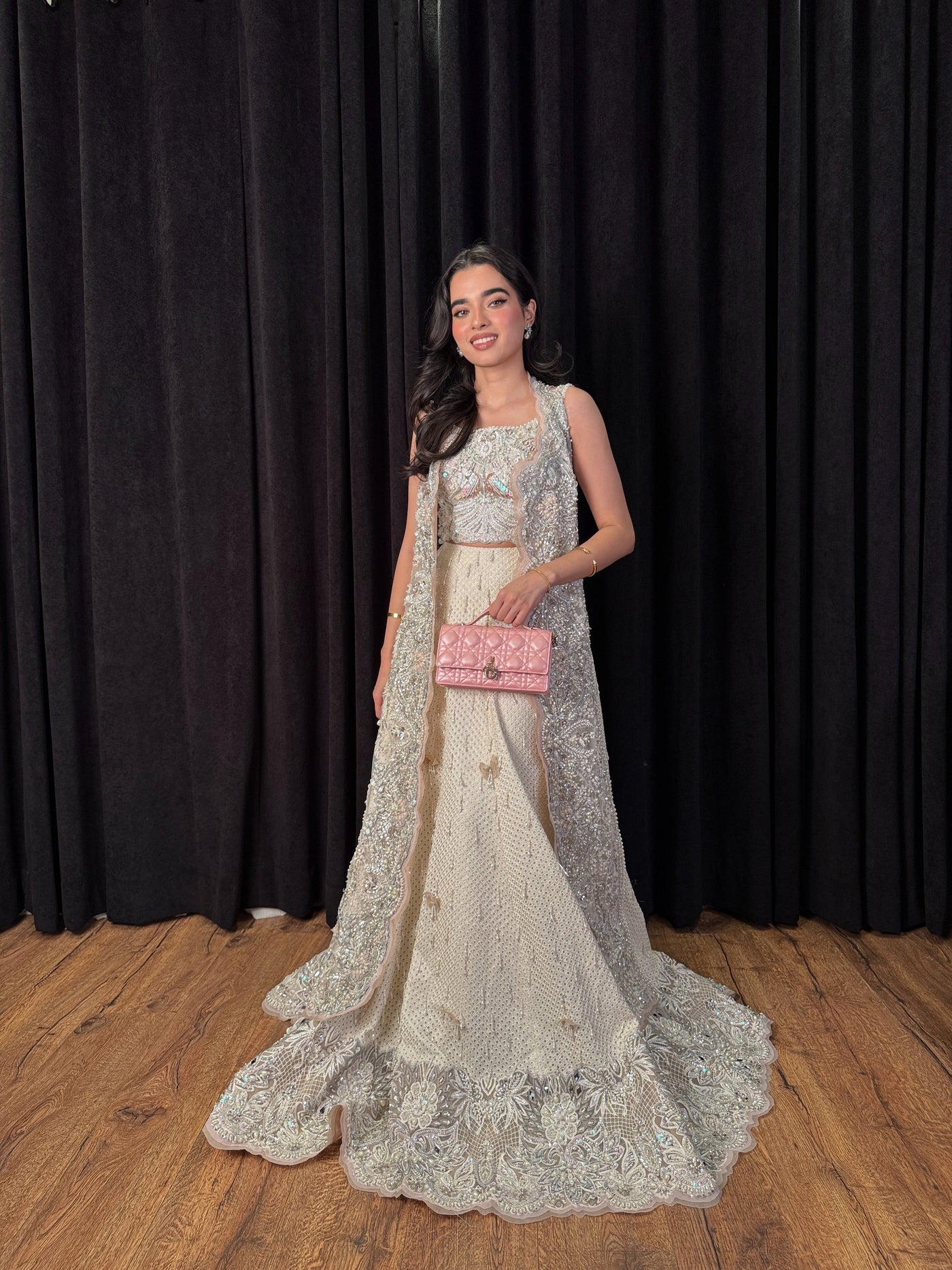 https://cdn.shopify.com/s/files/1/0523/4327/5696/files/mysie-by-tahira-minsa-ivory-net-lehenga-3.jpg?v=1757421769