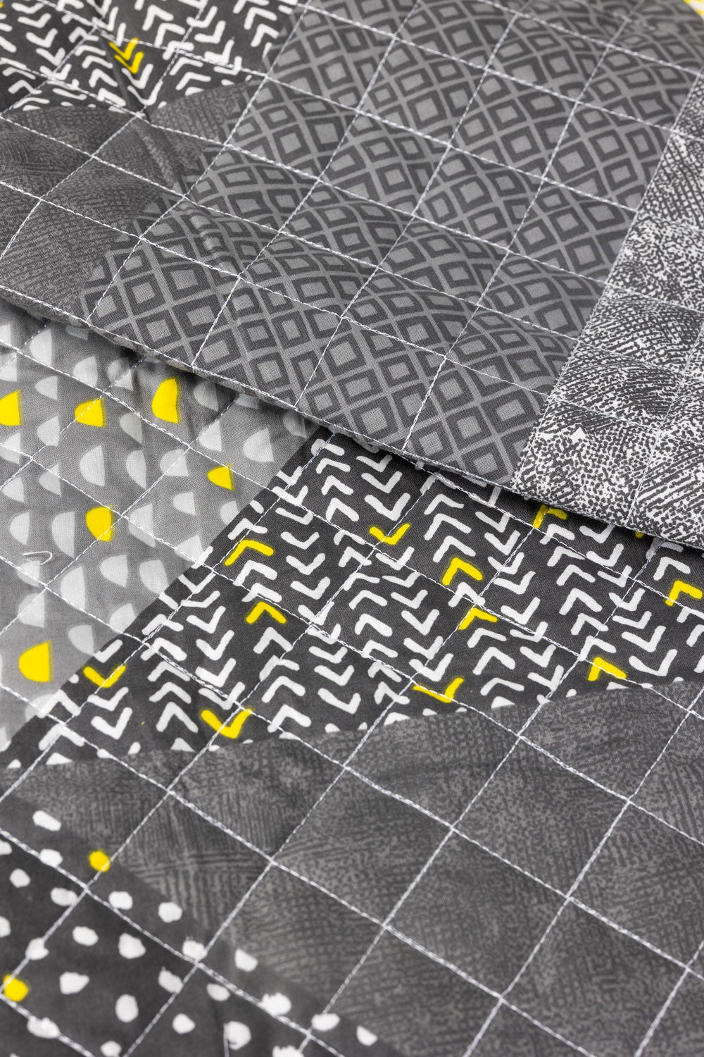 https://cdn.shopify.com/s/files/1/0706/3253/8159/files/neo_abstract_quilted_mat_3.jpg?v=1758373788