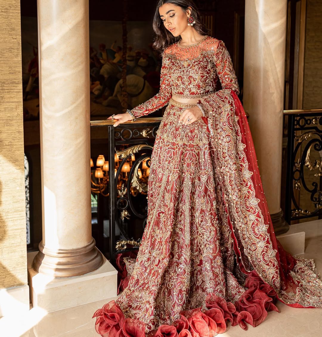 https://cdn.shopify.com/s/files/1/0523/4327/5696/files/nora-deep-red-bridal-lehnga-mysie-1.jpg?v=1757924251