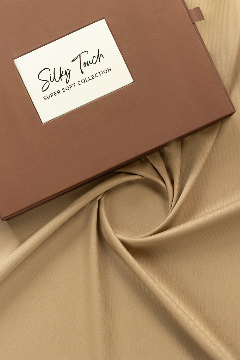 https://cdn.shopify.com/s/files/1/0706/3253/8159/files/tanabana-royal-hmb-03-unstitched-fabric-cotton-khaki-fullshot-top-with-box.jpg?v=1774441051