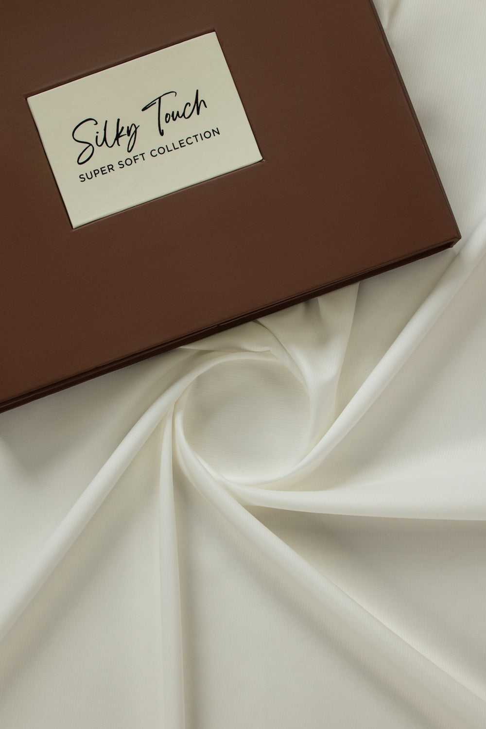 https://cdn.shopify.com/s/files/1/0706/3253/8159/files/tanabana-royal-hmb-03-unstitched-fabric-cotton-off-white--fullshot-top-with-box.jpg?v=1774440936
