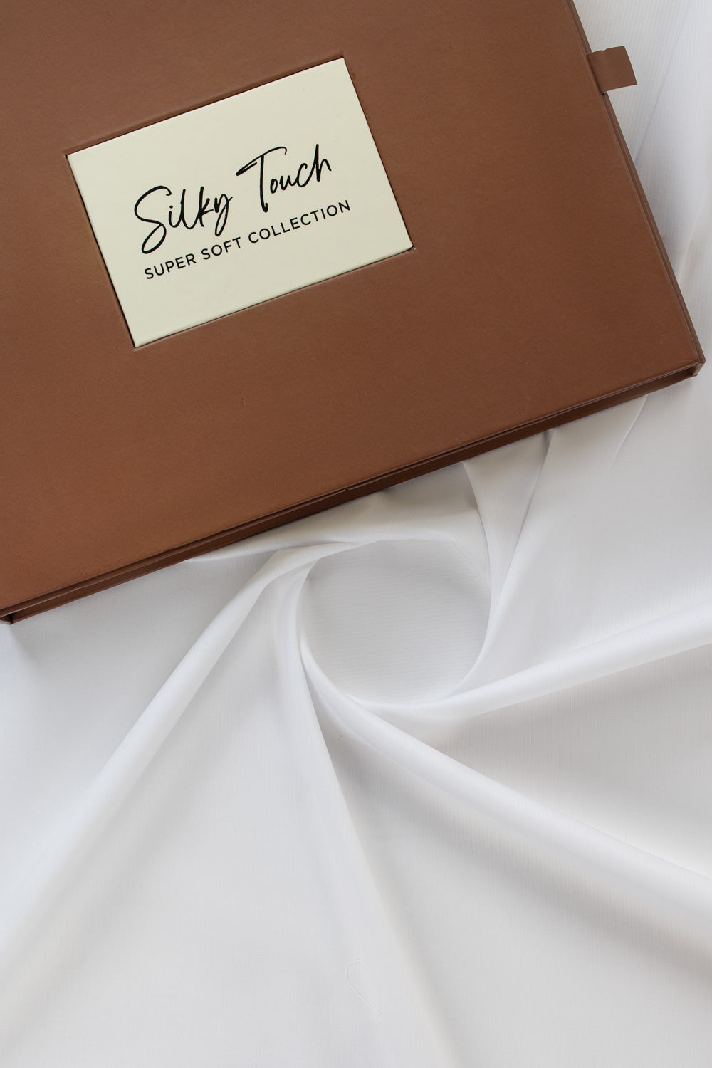 https://cdn.shopify.com/s/files/1/0706/3253/8159/files/tanabana-royal-hmb-03-unstitched-fabric-cotton-white-fullshot-top-with-box.jpg?v=1774441001